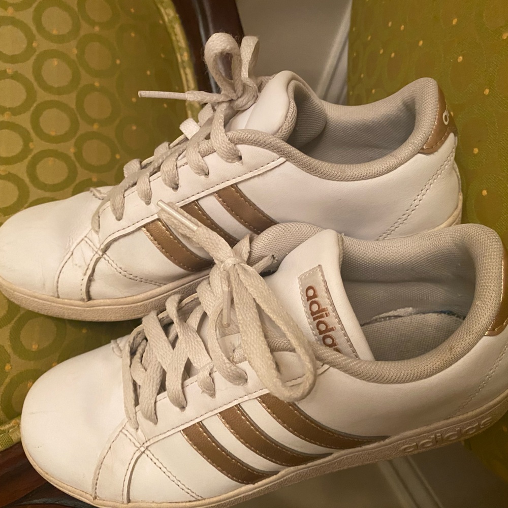 Adidas White and gold sneakers.